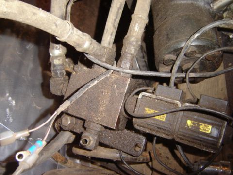 1992 Ford Bronco - Detail shot of engine parts, including hoses, wires, and electrical connectors.