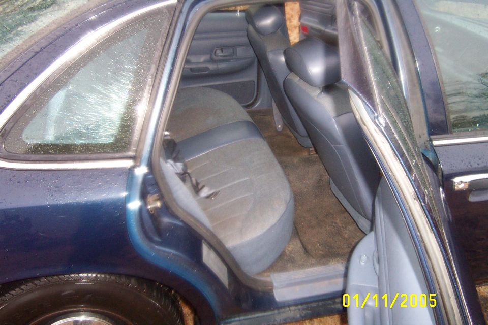 1997 Ford Crown Victoria interior showing rear seats and door panel