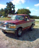1994 Ford Bronco - This 1994 Ford Bronco is seen in a three-quarter front view under a partly cloudy sky.