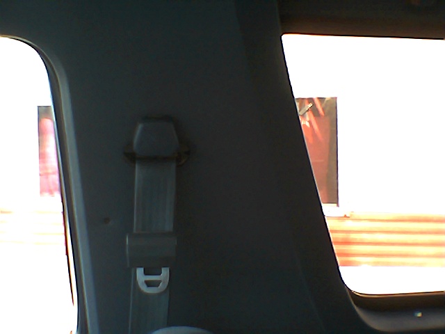 Interior trim panel with seatbelt anchor visible
