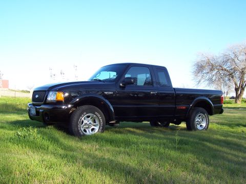 2003 Ford Ranger - Black 2003 Ford Ranger Edge pickup truck seen from the front quarter angle.