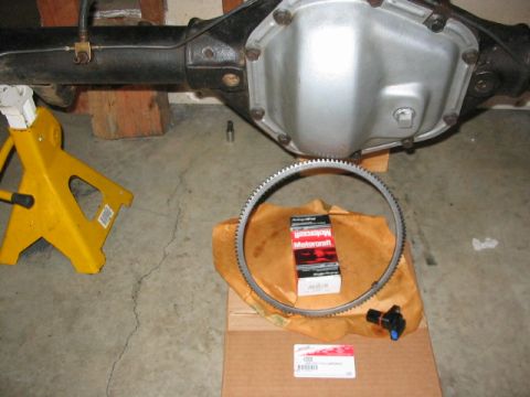 1995 Ford Bronco - Rear axle differential assembly with new Motorcraft parts laid out for installation.