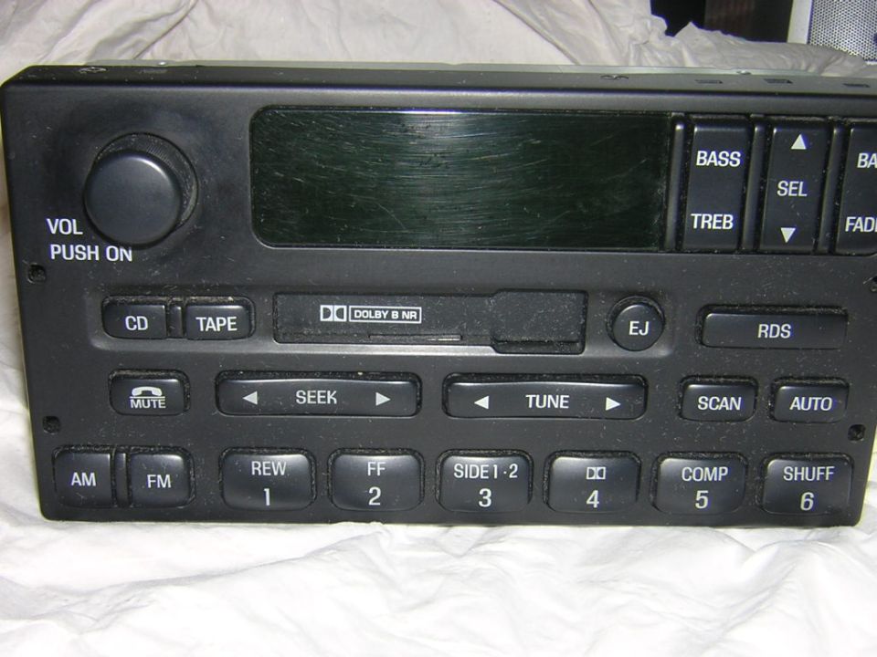 Front face of a Ford cassette car stereo with AM FM tape and Dolby controls