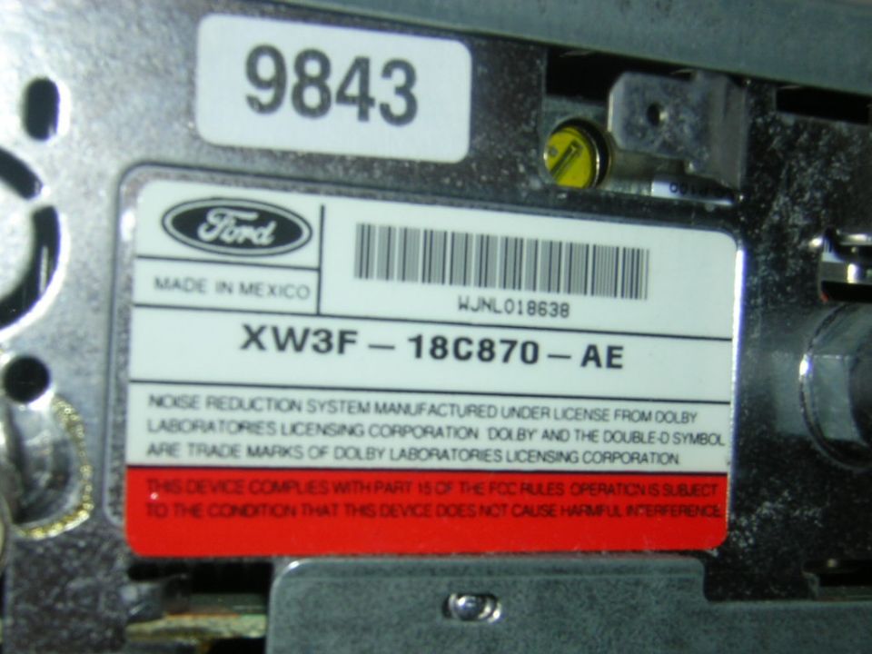 Ford module label reading XW3F-18C870-AE, Made in Mexico, with Dolby noise reduction notice