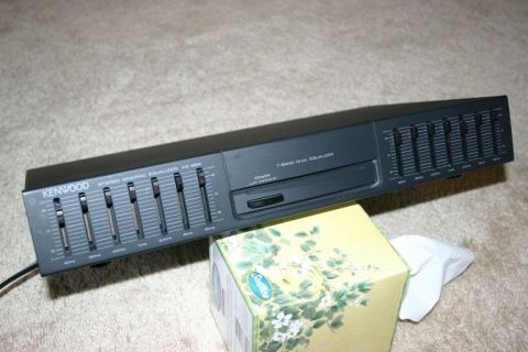 2003 Jeep TJ - A Kenwood stereo graphic equalizer is shown resting on a tissue box.
