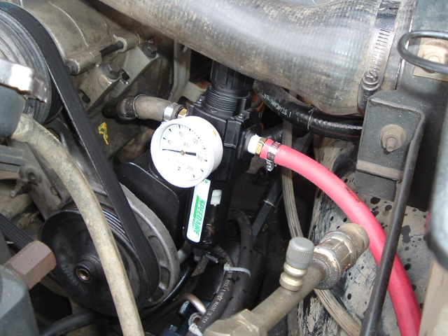 oil filter, regulator, gauge, and pop off valve (on the back side of the filter housing)