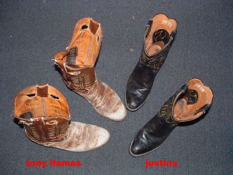 1993 Ford Bronco - Two pairs of cowboy boots are displayed on a carpeted surface.