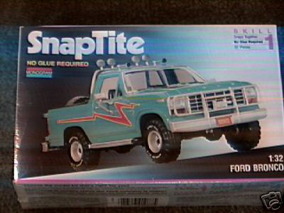 1990 Ford Bronco - Monogram SnapTite 1:32 Ford Bronco model kit box featuring a teal pickup with red striping on the front.