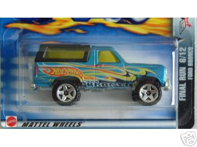 1990 Ford Bronco - blue Hot Wheels Ford Bronco die-cast toy with flame graphics sealed in its blister card, marked Final Run 6/12.