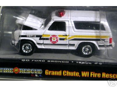 1990 Ford Bronco - white Ford Bronco fire-rescue die-cast model labeled Unit 12, displayed in a Fire Rescue USA package.