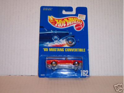 1990 Ford Bronco - red Hot Wheels '65 Mustang Convertible die-cast, collector number 162, sealed in its blue blister card.