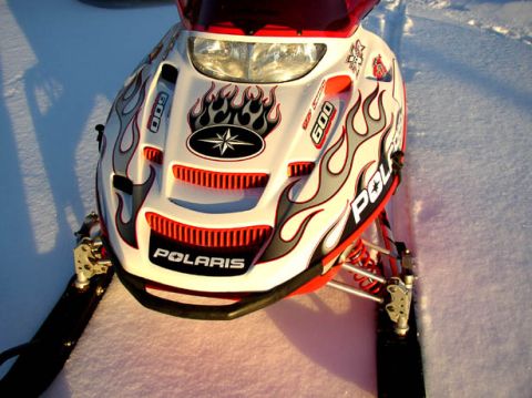 2003 Polaris 600 PRO X - This 2003 Polaris 600 PRO X snowmobile features striking flame graphics on its front fairing.