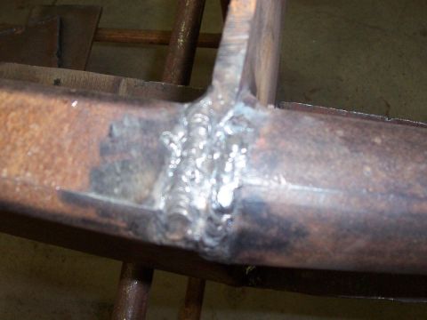 1989 Ford Bronco - This photo shows a close-up view of a welded metal joint on a rusty frame, not a 1989 Ford Bronco bumper.
