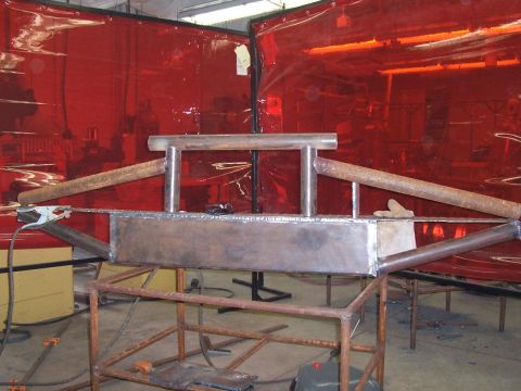 1989 Ford Bronco - A custom bumper is under construction, showing welded metal components and support structures.