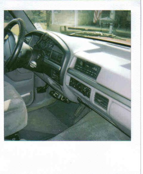 1995 Ford Bronco - The interior of a truck, focusing on the dashboard and driver's side.
