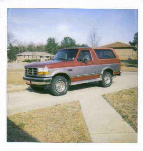 1995 Ford Bronco - This 1995 Ford Bronco is parked in front of a residential building.