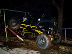 1983 Ford Bronco - A heavily modified SUV is positioned on an uneven surface, highlighting its off-road capabilities.