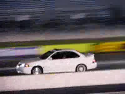 1994 Ford Probe - Robert running a 13.7 with slicks and 75 shot.