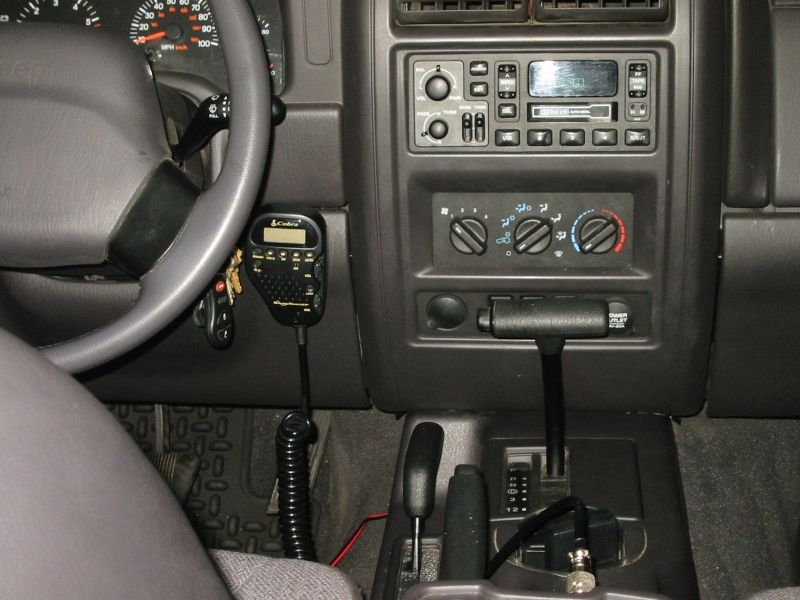 Early mounting location for the Cobra 75 WX ST handset.  I later moved it into the panel directly above where it's mounted in this photo.  Audio output was much improved, and it was easier to get at the controls while driving.