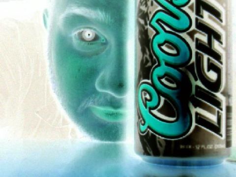 1971 Ford Mustang - A person's face and a Coors Light can are shown in this inverted color photograph.