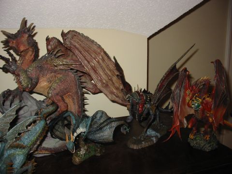 1991 Ford Bronco - Several detailed dragon figurines are displayed together on a shelf.