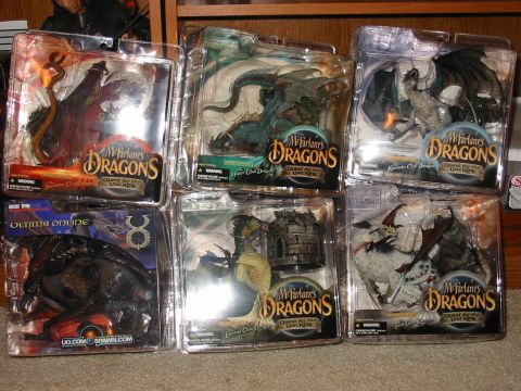 1991 Ford Bronco - A collection of McFarlane's Dragons action figures are displayed in their original packaging.