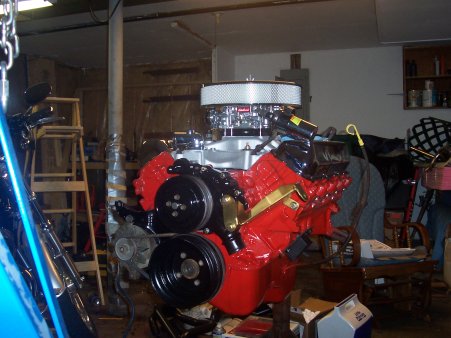 1986 Ford Bronco - Engine assembly in a garage setting, possibly for a 460 swap project.
