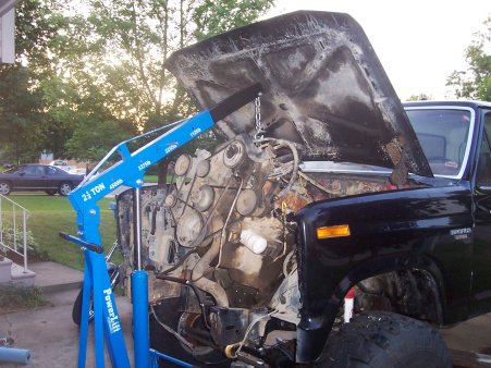 1986 Ford Bronco - Engine hoist is used to remove the engine from a 1986 Ford Bronco.