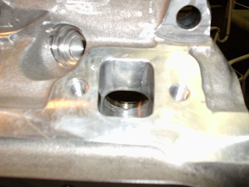 This is a Photo of one of the exaust ports on the GT40 heads. You can plainly see that it has been Jornal and pocket ported, as well as Polished to a Reflective surface. This is important for exaust ports, dosnt matter for intake.