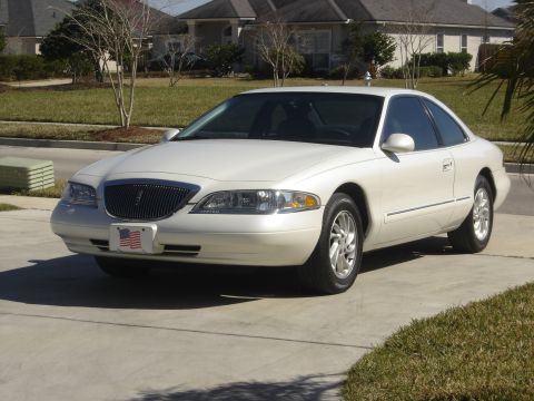 1997 Lincoln Mark VIII - 1997 Lincoln Mark VIII coupe shown from the front three-quarter view on a sunny day.