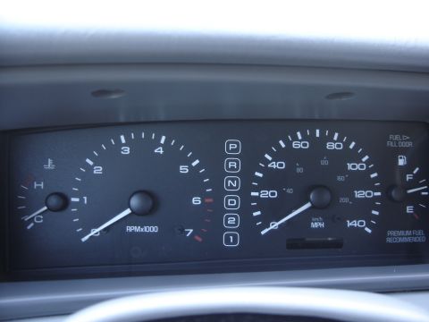 1997 Lincoln Mark VIII - The dashboard gauges of a 1997 Lincoln Mark VIII, showing the speedometer, tachometer, and gear selector.