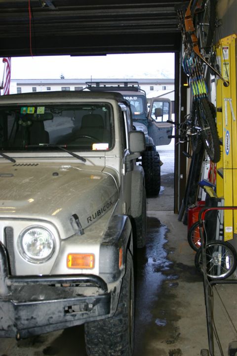 2003 Jeep TJ - Two Jeep Wranglers parked inside a garage, one is a 2003 TJ Rubicon.