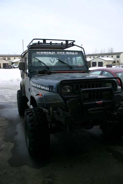 2003 Jeep TJ - This Jeep Wrangler, modified for off-road use, does not appear to be a 2003 model based on its body style.