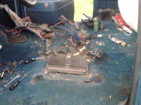 1984 Ford Bronco - First remove seats, seatbelt anchors, console, stereo amps, CB, etc. Found $2.59 in change!