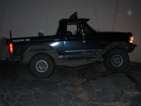 1995 Ford Bronco - This modified Ford Bronco is seen from the side, with "ROCKSTAR FAB" painted on its rear panel.