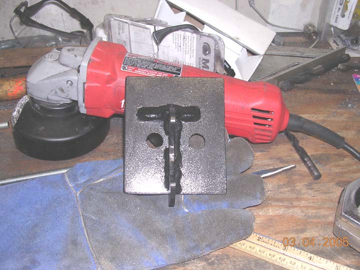 bracket finished and painted.  ready for install. The grinder gives an idea of how large the bracket is.