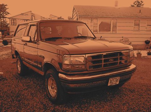 1995 Ford Bronco - This 1995 Ford Bronco is parked outside a house.