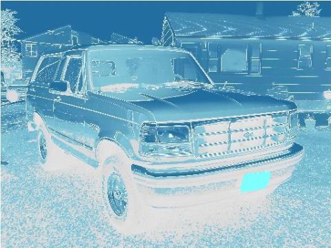 1995 Ford Bronco - This 1995 Ford Bronco is shown from the front three-quarter view, parked in a residential area.