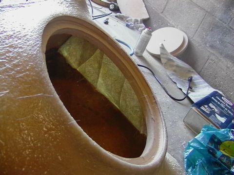 1999 Ford Taurus - Custom fiberglass enclosure construction in progress, with insulation visible inside the opening.
