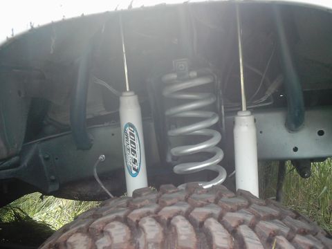 1978 Ford Bronco - Pro Comp ES9000 shocks and coil spring visible on a vehicle's suspension.