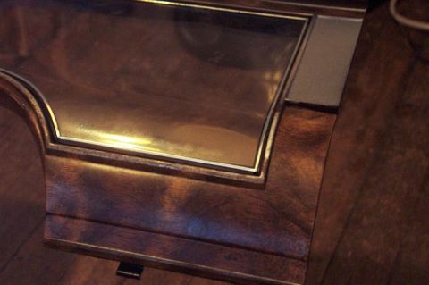 1985 Ford LTD Crown Victoria - Close-up of wood grain interior trim with a chrome accent strip.