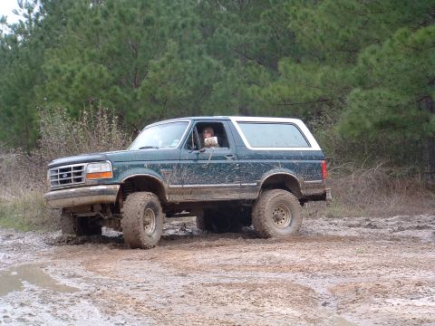 1993 Ford Bronco - This 1993 Ford Bronco is navigating a challenging muddy terrain.