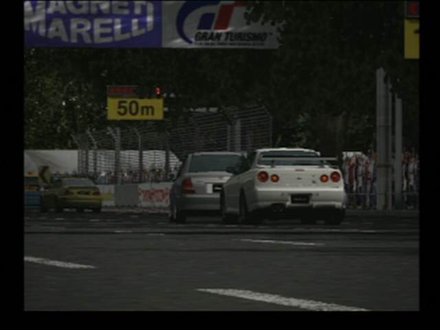 Gran Turismo game screenshot: white Skyline and silver sedan racing past a 50m marker