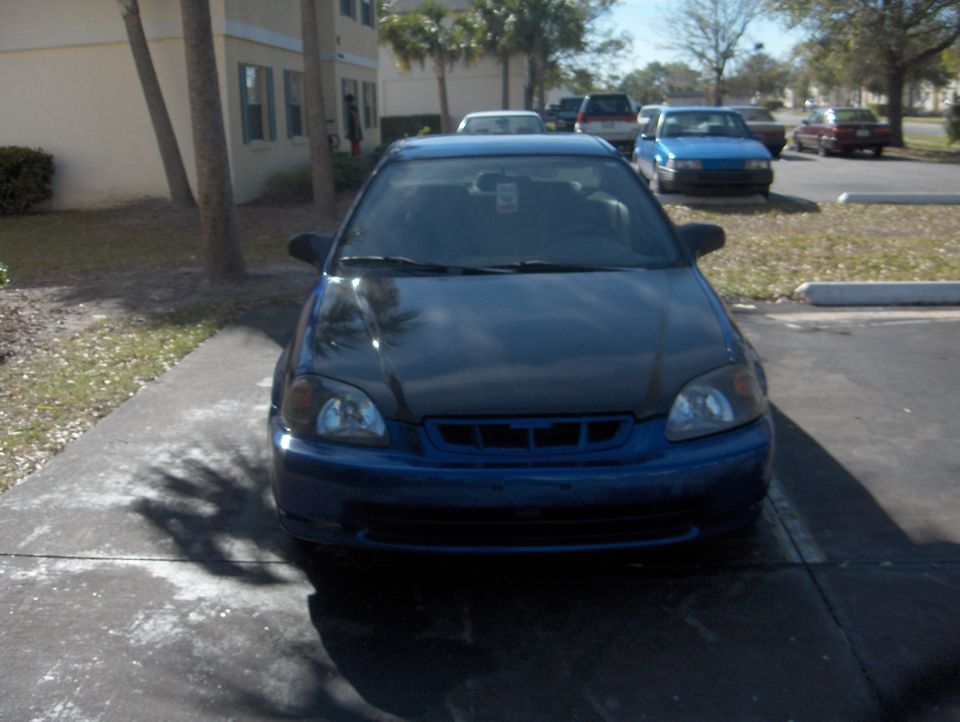 Dark blue Honda Civic front view parked on driveway