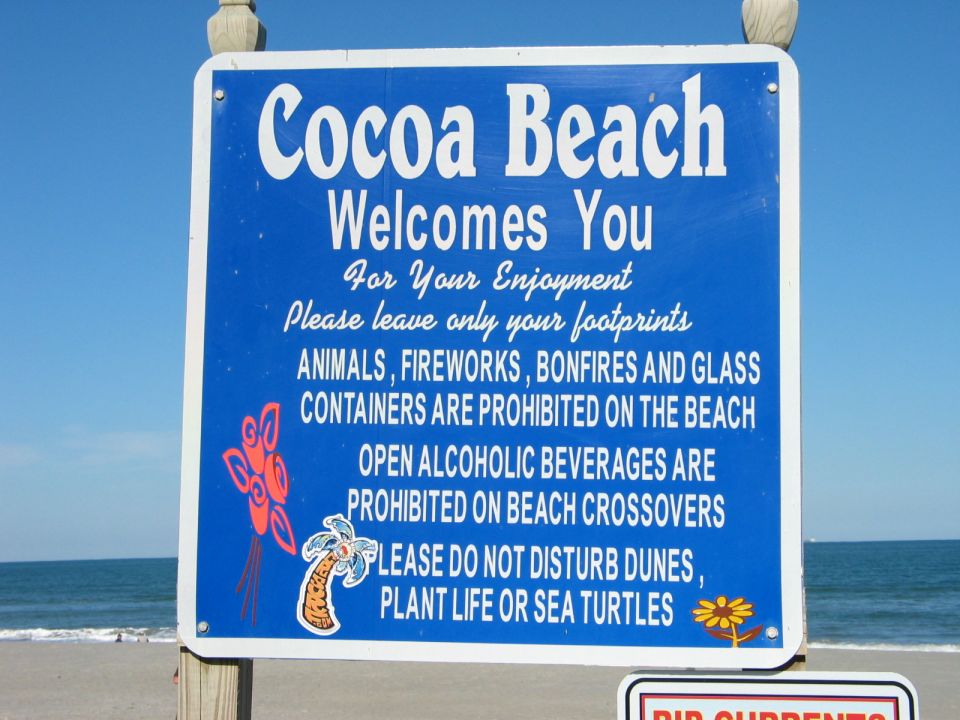 Sign at Cocoa Beach welcoming visitors and listing beach rules