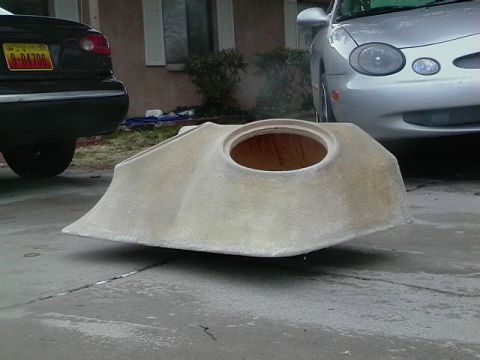 1999 Ford Taurus - A custom fiberglass part sits on a driveway in front of a silver 1999 Ford Taurus.