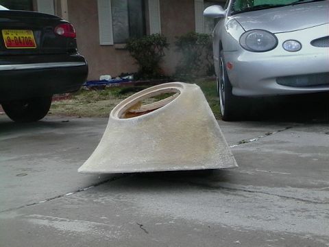 1999 Ford Taurus - A custom fiberglass part sits on a driveway between two cars.