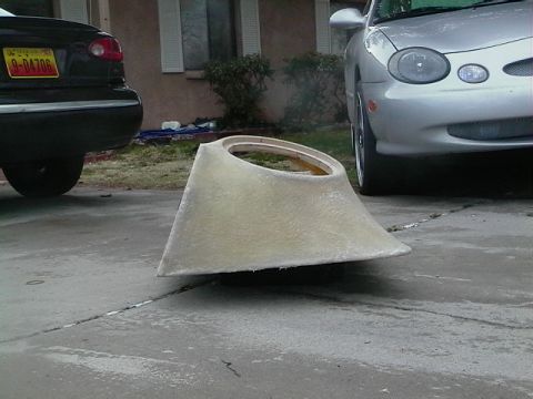 1999 Ford Taurus - A custom fiberglass part sits on a driveway between two vehicles.