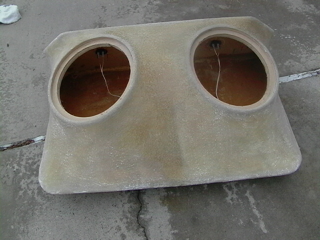 Dual speaker enclosure with two circular openings and wiring
