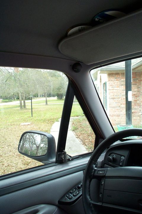 1996 Ford Bronco - Interior view from the driver's seat of a gray-trimmed 1990s Ford truck, showing an aftermarket tweeter flush-mounted in the A-pillar sail…